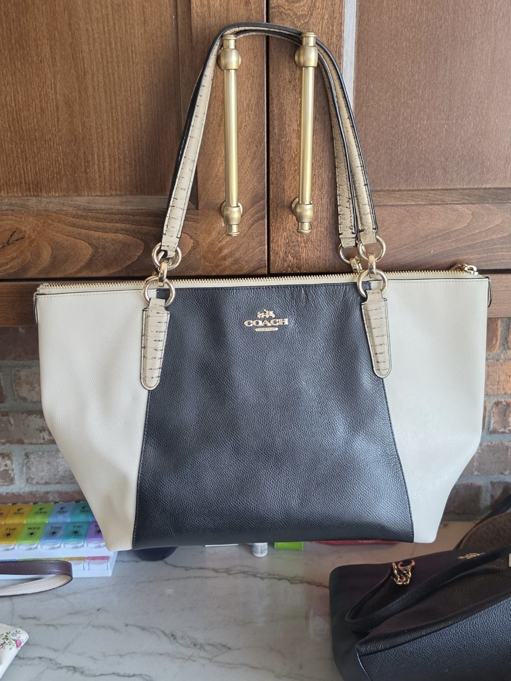 Coach Two-Tone Black and Cream Leather Tote with Gold Hardware